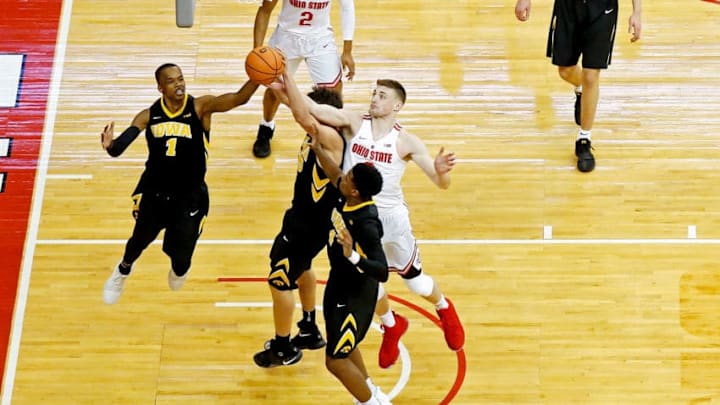 COLUMBUS, OH - FEBRUARY 10: Maishe Dailey #1 of the Iowa Hawkeyes and Micah Potter #0 of the Ohio State Buckeyes compete for a rebound during the game at Value City Arena on February 10, 2018 in Columbus, Ohio. Ohio State defeated Iowa 82-64. (Photo by Kirk Irwin/Getty Images)