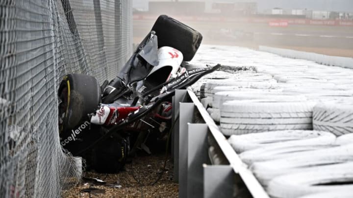 Alfa Romeo Chinese driver Zhou Guanyu is seen in the crash barriers during an incident at the star during the Formula One British Grand Prix at the Silverstone motor racing circuit in Silverstone, central England on July 3, 2022. (Photo by Ben Stansall / AFP) (Photo by BEN STANSALL/AFP via Getty Images)