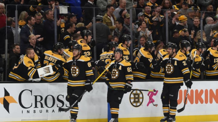 BOSTON, MA - OCTOBER 26: David Pastrnak #88, Brad Marchand #63 and Patrice Bergeron #37 of the Boston Bruins celebrate the goal against the St. Louis Blues at the TD Garden on October 26, 2019 in Boston, Massachusetts. (Photo by Steve Babineau/NHLI via Getty Images)