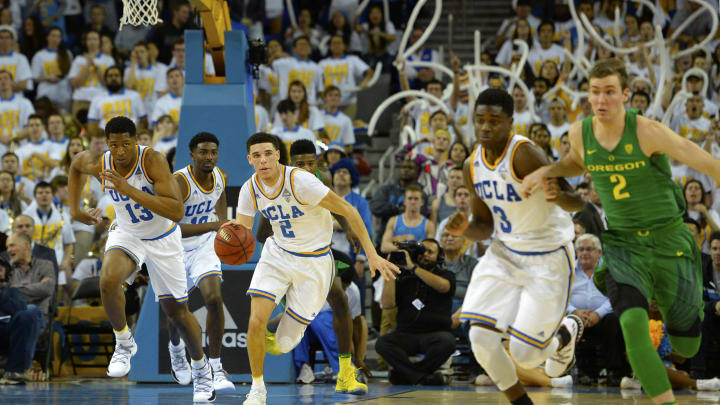 LOS ANGELES, CA – FEBRUARY 9: Lonzo Ball #2 of the UCLA Bruins dribbles the ball and attacks with Ike Anigbogu #13, Isaac Hamilton #10 and Aaron Holiday #3 of the Bruins as Casey Benson #2 of the Oregon Ducks runs back at Pauley Pavilion on February 9, 2017 in Los Angeles, California. (Photo by Robert Laberge/Getty Images)