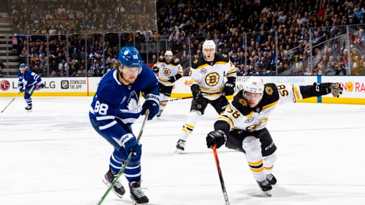 TORONTO, ON - NOVEMBER 15: William Nylander #88 of the Toronto Maple Leafs shoots the puck against Urho Vaakanainen #58 of the Boston Bruins during the third period at the Scotiabank Arena on November 15, 2019 in Toronto, Ontario, Canada. (Photo by Mark Blinch/NHLI via Getty Images)