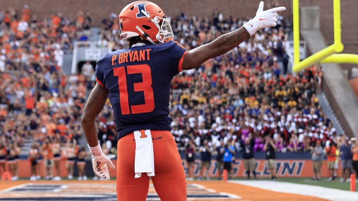 CHAMPAIGN, ILLINOIS – SEPTEMBER 10: Pat Bryant #13 of the Illinois Fighting Illini reacts after a catch during the first quarter in the game against the Virginia Cavaliers at Memorial Stadium on September 10, 2022 in Champaign, Illinois. (Photo by Justin Casterline/Getty Images)