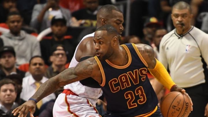 May 6, 2016; Atlanta, GA, USA; Cleveland Cavaliers forward LeBron James (23) works against Atlanta Hawks forward Paul Millsap (4) during the first half in game three of the second round of the NBA Playoffs at Philips Arena. Mandatory Credit: Dale Zanine-USA TODAY Sports