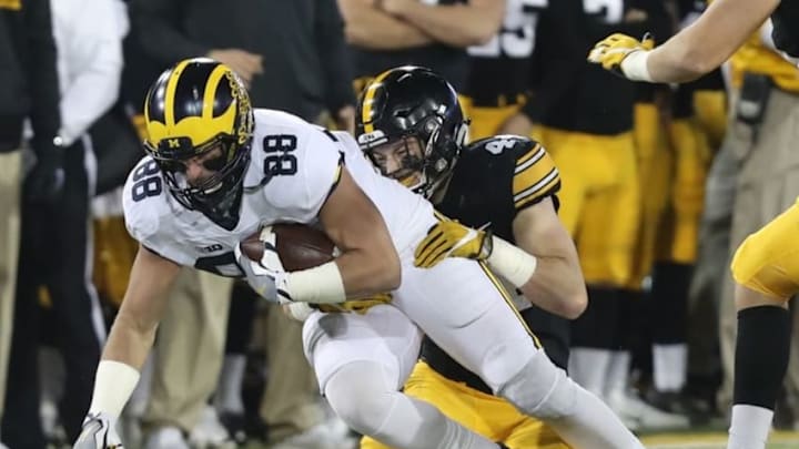 Nov 12, 2016; Iowa City, IA, USA; Iowa Hawkeyes linebacker Ben Niemann (44) tackles Michigan Wolverines tight end Jake Butt (88) during the first half at Kinnick Stadium. Mandatory Credit: Reese Strickland-USA TODAY Sports