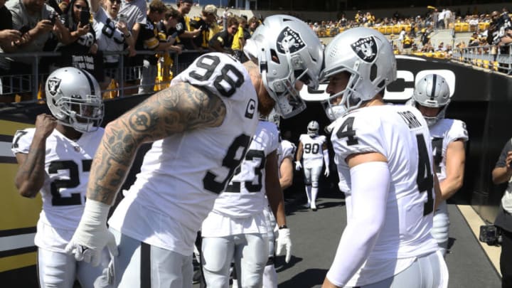 Las Vegas Raiders defensive end Maxx Crosby and quarterback Derek Carr. (Charles LeClaire-USA TODAY Sports)