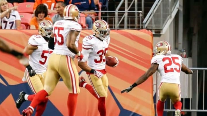 Aug 20, 2016; Denver, CO, USA; San Francisco 49ers strong safety Jimmie Ward (25) celebrates the touchdown of free safety Eric Reid (35) in the second quarter against the Denver Broncos at Sports Authority Field at Mile High. Mandatory Credit: Isaiah J. Downing-USA TODAY Sports