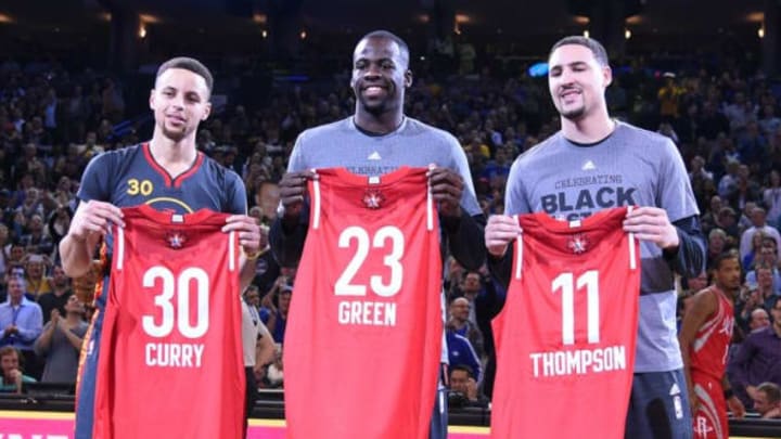 February 9, 2016; Oakland, CA, USA; Golden State Warriors guard Stephen Curry (30), forward Draymond Green (23), and guard Klay Thompson (11) hold their all star jerseys before the game against the Houston Rockets at Oracle Arena. Mandatory Credit: Kyle Terada-USA TODAY Sports