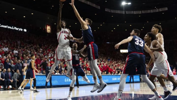 TUCSON, ARIZONA - DECEMBER 14: Dylan Smith #3 of the Arizona Wildcats shoots the ball in front of Filip Petrusev #3 of the Gonzaga Bulldogs in the first half at McKale Center on December 14, 2019 in Tucson, Arizona. (Photo by Jennifer Stewart/Getty Images)
