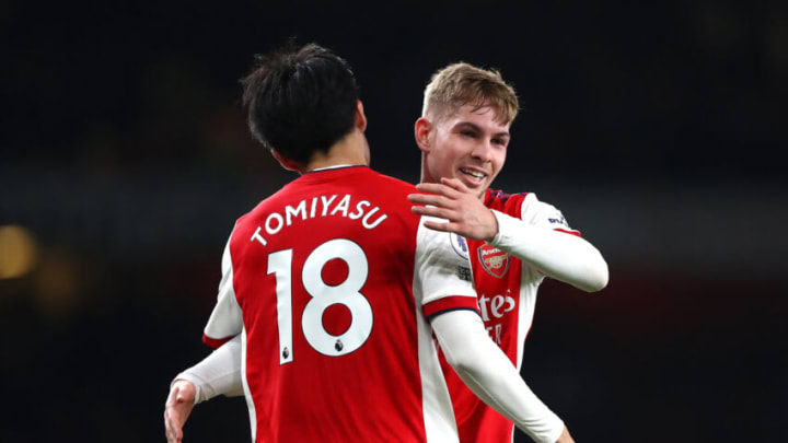 LONDON, ENGLAND - DECEMBER 15: Emile Smith Rowe of Arsenal and Takehiro Tomiyasu of Arsenal hug after the Premier League match between Arsenal and West Ham United at Emirates Stadium on December 15, 2021 in London, England. (Photo by Chloe Knott - Danehouse/Getty Images)