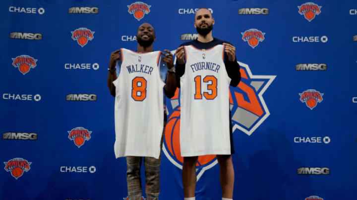 Aug 17, 2021; New York, New York, USA; New York Knicks guards Kemba Walker (8) and Evan Fournier (13) pose for a photo during their introductory press conference at Madison Square Garden. Mandatory Credit: Brad Penner-USA TODAY Sports
