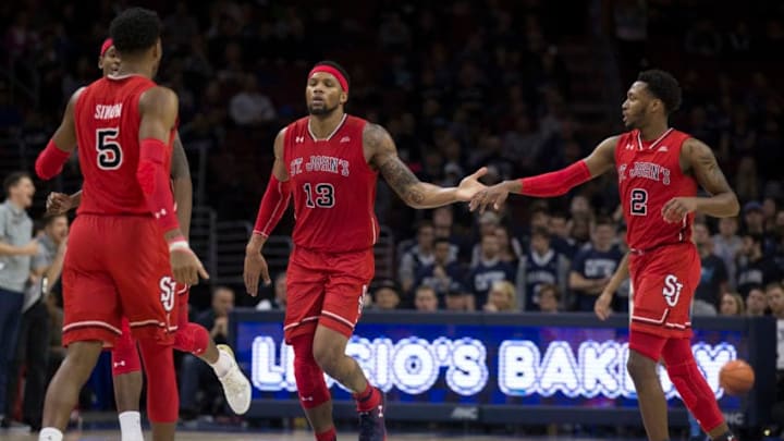 PHILADELPHIA, PA - FEBRUARY 7: Justin Simon #5, Tariq Owens #11, Marvin Clark II #13, and Shamorie Ponds #2 of the St. John's Red Storm celebrate against the Villanova Wildcats at the Wells Fargo Center on February 7, 2018 in Philadelphia, Pennsylvania. (Photo by Mitchell Leff/Getty Images)