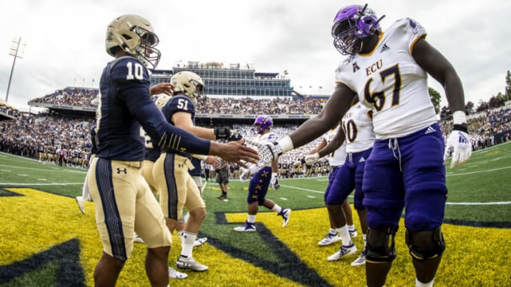 ANNAPOLIS, MD - SEPTEMBER 14: Malcom Perry #10 of the Navy Midshipmen shakes hands with D'Ante Smith #67 of the East Carolina Pirates ahead of a game at Navy-Marine Corps Stadium on September 14, 2019 in Annapolis, Maryland (Photo by Benjamin Solomon/Getty Images)