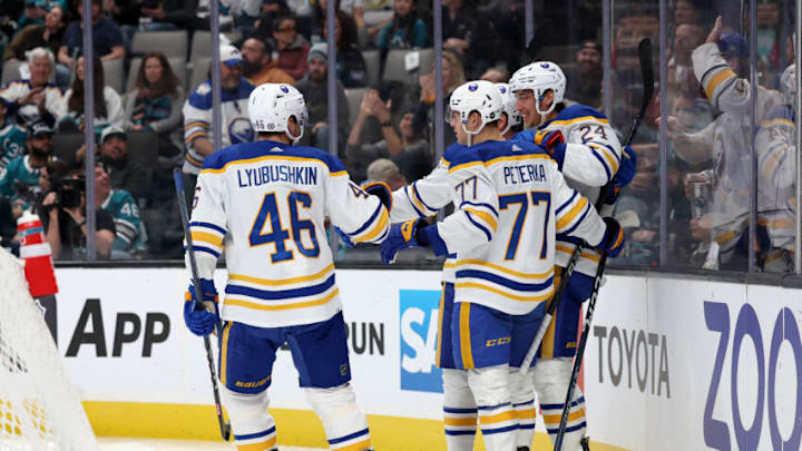 SAN JOSE, CALIFORNIA - FEBRUARY 18: Dylan Cozens #24 of the Buffalo Sabres is congratulated by teammates after he scored a goal against the San Jose Sharks in the first period at SAP Center on February 18, 2023 in San Jose, California. (Photo by Ezra Shaw/Getty Images)