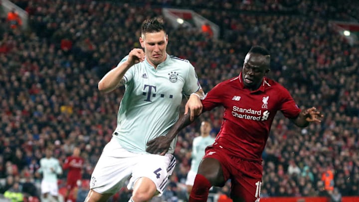 LIVERPOOL, ENGLAND - FEBRUARY 19: Bayern Munich's Niklas Sule battles with Liverpool's Sadio Mane during the UEFA Champions League Round of 16 First Leg match between Liverpool and FC Bayern Muenchen at Anfield on February 19, 2019 in Liverpool, England. (Photo by Rich Linley - CameraSport via Getty Images)