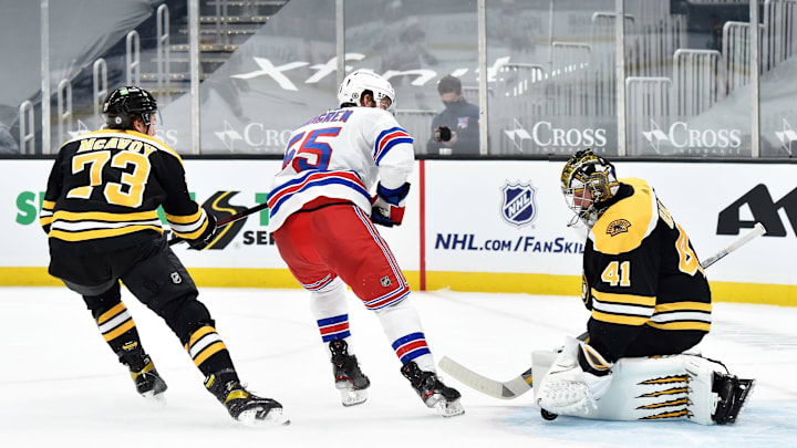 Mar 11, 2021; Boston, Massachusetts, USA; Boston Bruins goaltender Jaroslav Halak (41) makes a save on New York Rangers defenseman Ryan Lindgren (55) while defenseman Charlie McAvoy (73) during the second period at TD Garden. Mandatory Credit: Bob DeChiara-USA TODAY Sports