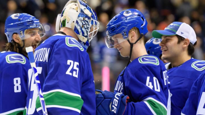 VANCOUVER, BC - FEBRUARY 09: Vancouver Canucks Goaltender Jacob Markstrom (25) celebrates with Center Elias Pettersson (40) after their NHL game against the Calgary Flames at Rogers Arena on February 9, 2019 in Vancouver, British Columbia, Canada. Vancouver won 4-3 in a shootout. (Photo by Derek Cain/Icon Sportswire via Getty Images)