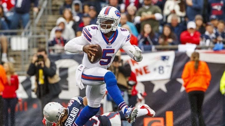 Oct 2, 2016; Foxborough, MA, USA; Buffalo Bills quarterback Tyrod Taylor (5) breaks a way from New England Patriots defensive end Jabaal Sheard (93) in the second half at Gillette Stadium. The Bills defeated the Patriots 16-0. Mandatory Credit: David Butler II-USA TODAY Sports