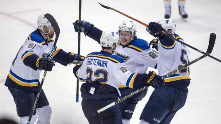 Apr 29, 2016; Dallas, TX, USA; St. Louis Blues defenseman Kevin Shattenkirk (22) and center Patrik Berglund (21) and right wing Vladimir Tarasenko (91) and defenseman Colton Parayko (55) celebrate the goal by Shattenkirk against the Dallas Stars during the third period in game one of the second round of the 2016 Stanley Cup Playoffs at the American Airlines Center. The Stars defeat the Blue 2-1. Mandatory Credit: Jerome Miron-USA TODAY Sports