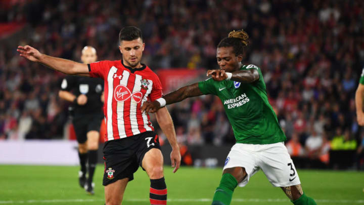 SOUTHAMPTON, ENGLAND - SEPTEMBER 17: Shane Long of Southampton is challenged by Gaetan Bong of Brighton and Hove Albion during the Premier League match between Southampton and Brighton & Hove Albion at St Mary's Stadium on September 17, 2018 in Southampton, United Kingdom. (Photo by Dan Mullan/Getty Images)