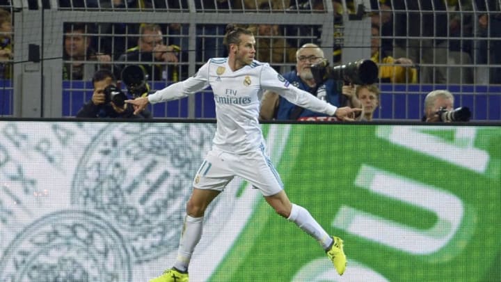 DORTMUND, GERMANY - SEPTEMBER 26: Gareth Bale of Real Madrid celebrates after scoring his team`s first goal during the UEFA Champions League group H match between Borussia Dortmund and Real Madrid at Signal Iduna Park on September 26, 2017 in Dortmund, Germany. (Photo by TF-Images/TF-Images via Getty Images)