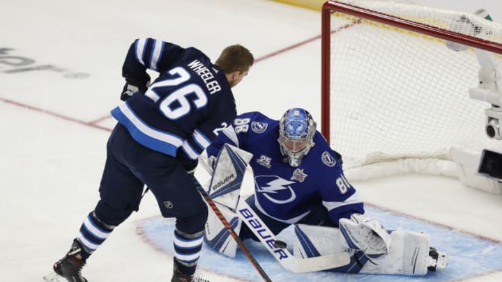 TAMPA, FL - JANUARY 27: Tampa Bay Lightning goaltender Andrei Vasilevskiy (88) makes a save on a shot from Winnipeg Jets forward Blake Wheeler (26) during the GEICO NHL Save Streak competition during the NHL All-Star Skills Competition on January 27, 2018 at Amalie Arena in Tampa, FL. (Photo by Mark LoMoglio/Icon Sportswire via Getty Images)