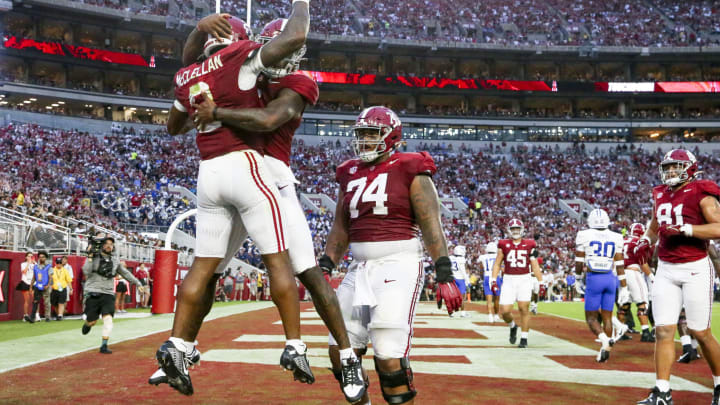 Sep 2, 2023; Tuscaloosa, Alabama, USA; Alabama Crimson Tide running back Jase McClellan (2) celebrates with quarterback Jalen Milroe (4) after scoring a touchdown against the Middle Tennessee Blue Raiders during the first half at Bryant-Denny Stadium. Mandatory Credit: Gary Cosby Jr.-USA TODAY Sports
