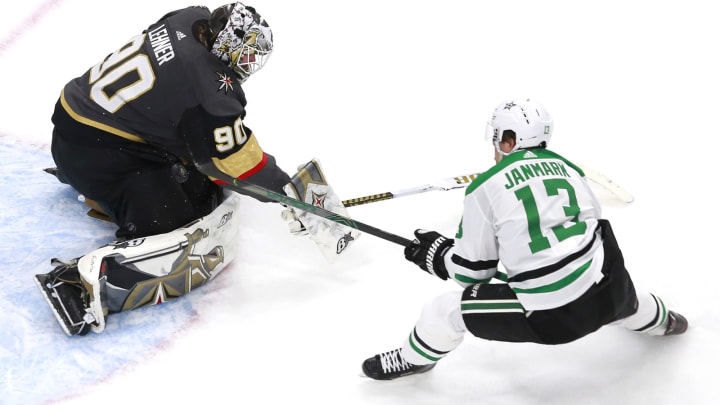 Robin Lehner #90 of the Vegas Golden Knights stops a shot by Mattias Janmark #13 of the Dallas Stars in the final minutes of the game in a Western Conference Round Robin game.