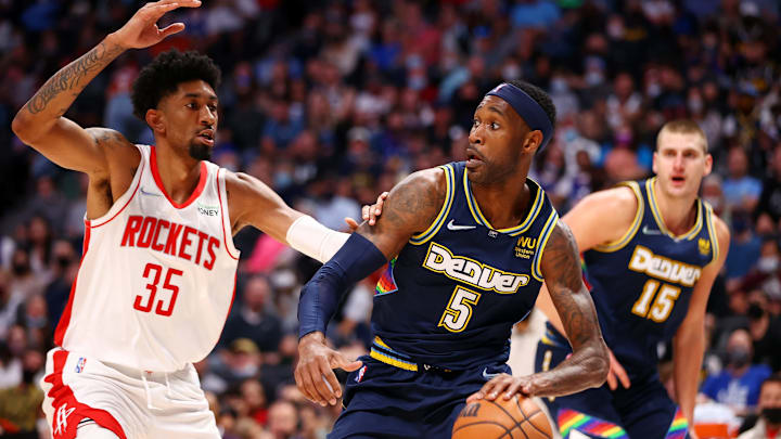 DENVER, CO - NOVEMBER 06: Will Barton #5 of the Denver Nuggets drives against Christian Wood #35 of the Houston Rockets at Ball Arena on November 6, 2021 in Denver, Colorado. (Photo by Jamie Schwaberow/Getty Images)