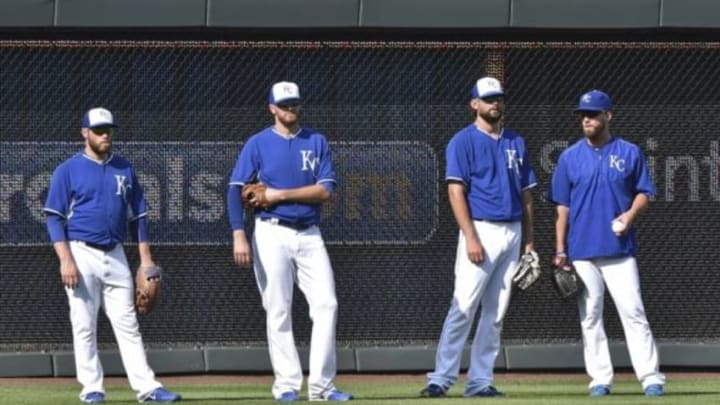 Aug 7, 2015; Kansas City, MO, USA; Kansas City Royals pitchers Greg Holland (far left), Wade Davis (left center), Luke Hochevar (right center) and Danny Duffy (far right) stand in the out field during batting practice prior to a game against the Chicago White Sox at Kauffman Stadium. Mandatory Credit: Peter G. Aiken-USA TODAY Sports