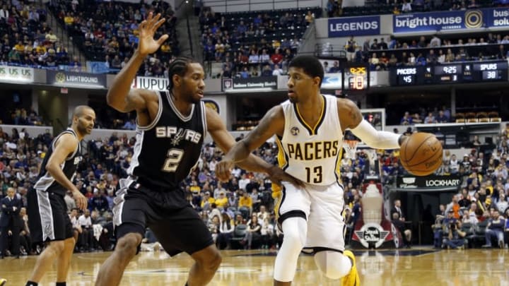 Mar 7, 2016; Indianapolis, IN, USA; NBA Indiana Pacers forward Paul George (13) drives to the basket against San Antonio Spurs guard Kawhi Leonard (2) at Bankers Life Fieldhouse. Indiana defeats San Antonio 99-91. Mandatory Credit: Brian Spurlock-USA TODAY Sports