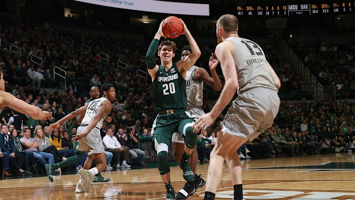 EAST LANSING, MI – DECEMBER 21: Matt McQuaid #20 of the Michigan State Spartans drives to the basket during a game against the Oakland Golden Grizzlies in the first half at Breslin Center on December 21, 2018 in East Lansing, Michigan. (Photo by Rey Del Rio/Getty Images)