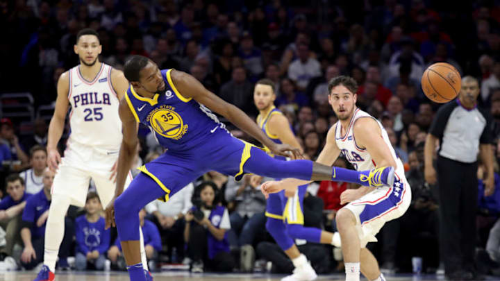 PHILADELPHIA, PA - NOVEMBER 18: Kevin Durant #35 of the Golden State Warriors goes after a loose ball against the Philadelphia 76ers in the first half at Wells Fargo Center on November 18, 2017 in Philadelphia,Pennsylvania. NOTE TO USER: User expressly acknowledges and agrees that, by downloading and or using this photograph, User is consenting to the terms and conditions of the Getty Images License Agreement. (Photo by Rob Carr/Getty Images)