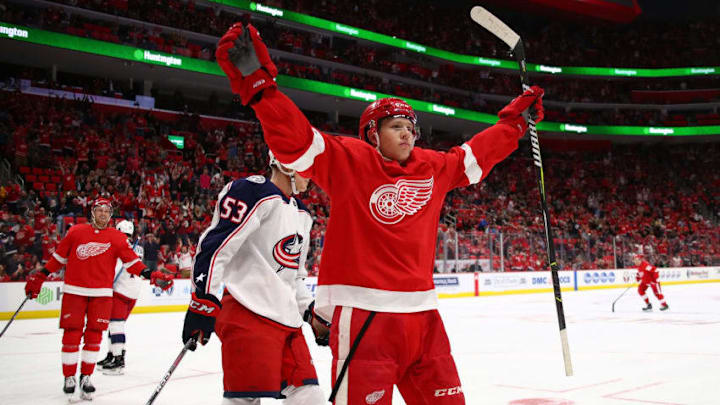 DETROIT, MI - OCTOBER 04: Dennis Cholowski #21 of the Detroit Red Wings celebrates his first NHL goal in the first period while playing the Columbus Blue Jackets at Little Caesars Arena on October 4, 2018 in Detroit, Michigan. (Photo by Gregory Shamus/Getty Images)