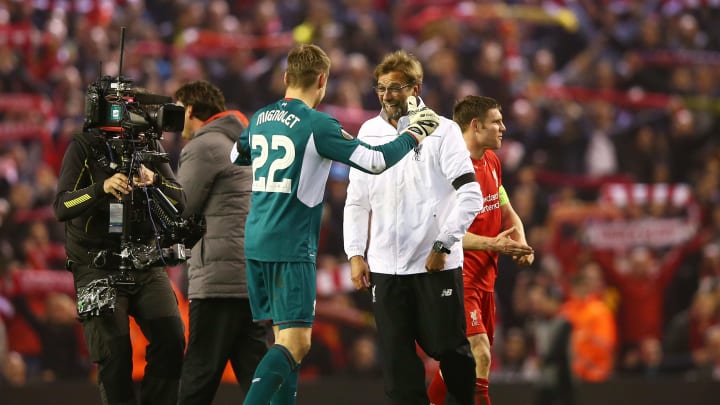 LIVERPOOL, ENGLAND – APRIL 14: Jurgen Klopp, manager of Liverpool celebrates victory with Simon Mignolet after the UEFA Europa League quarter final, second leg match between Liverpool and Borussia Dortmund at Anfield on April 14, 2016 in Liverpool, United Kingdom. (Photo by Clive Brunskill/Getty Images)