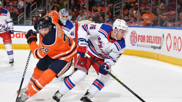 EDMONTON, AB - MARCH 11: Leon Draisaitl #29 of the Edmonton Oilers battles for the puck against Brady Skjei #76 of the New York Rangers on March 11, 2019 at Rogers Place in Edmonton, Alberta, Canada. (Photo by Andy Devlin/NHLI via Getty Images)