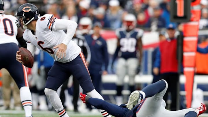 Oct 26, 2014; Foxborough, MA, USA; Chicago Bears quarterback Jay Cutler (6) carries the ball as New England Patriots outside linebacker Jamie Collins (91) defends during the fourth quarter at Gillette Stadium. The Patriots won 51-23. Mandatory Credit: Greg M. Cooper-USA TODAY Sports