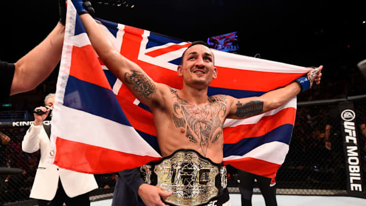 RIO DE JANEIRO, BRAZIL - JUNE 03: Max Holloway celebrates after his TKO victory over Jose Aldo of Brazil in their UFC featherweight championship bout during the UFC 212 event at Jeunesse Arena on June 3, 2017 in Rio de Janeiro, Brazil. (Photo by Jeff Bottari/Zuffa LLC/Zuffa LLC via Getty Images)