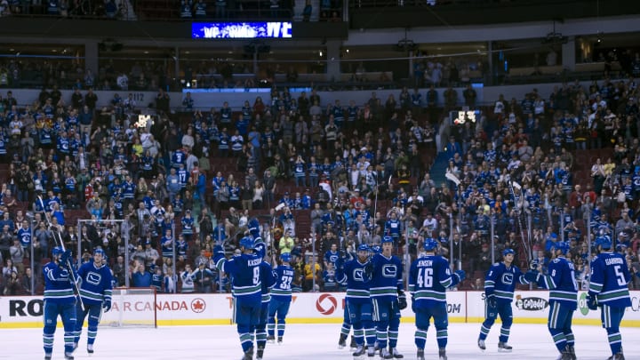 The Vancouver Canucks salute their fans after playing their last game of the season (Photo by Rich Lam/Getty Images)