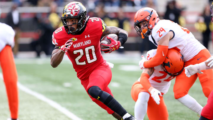 COLLEGE PARK, MD – OCTOBER 27: Javon Leake #20 of the Maryland Terrapins runs past Illinois Fighting Illini defenders during the first half at Capital One Field on October 27, 2018 in College Park, Maryland. (Photo by Will Newton/Getty Images)