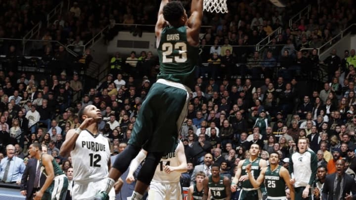 Feb 9, 2016; West Lafayette, IN, USA; Michigan State Spartans forward Deyonta Davis (23) dunks against Purdue Boilermakers forward Vince Edwards (12) at Mackey Arena. Purdue defeats Michigan State 82-81 in overtime. Mandatory Credit: Brian Spurlock-USA TODAY Sports