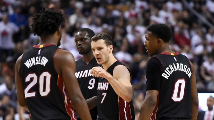 May 3, 2016; Toronto, Ontario, CAN; Miami Heat guard Goran Dragic (7) is greeted by team mates Justise Winslow (20), Luol Deng (9) and Josh Richardson (0) after hitting a three point shot plus a foul call against Toronto Raptors in game one of the second round of the NBA Playoffs at Air Canada Centre. Mandatory Credit: Dan Hamilton-USA TODAY Sports