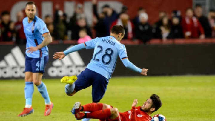 TORONTO, ON – MARCH 29: Alexandru Mitrita (28) of New York City FC fouls Alejandro Pozuelo (10) of Toronto FC during the first half of the MLS regular season match between Toronto FC and New York City FC on March 29, 2019, at BMO Field in Toronto, ON, Canada. (Photo by Julian Avram/Icon Sportswire via Getty Images)