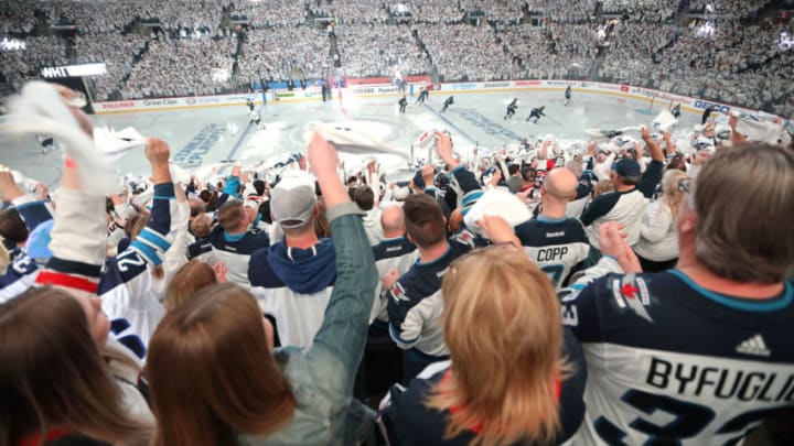 ARENA WHITEOUT:"nWINNIPEG, MANITOBA - APRIL 12: Winnipeg Jets fans bring on the 'whiteout' as the Winnipeg Jets took on the St. Louis Blues in Game Two of the Western Conference First Round during the 2019 NHL Stanley Cup Playoffs at Bell MTS Place on April 12, 2019 in Winnipeg, Manitoba, Canada. (Photo by Jason Halstead/Getty Images) *** Local Caption ***