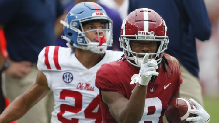 Oct 2, 2021; Tuscaloosa, Alabama, USA; Alabama wide receiver John Metchie III (8) gestures first down after making a catch with Ole Miss defensive back Deane Leonard (24) defending at Bryant-Denny Stadium. Alabama defeated Ole Miss 42-21. Mandatory Credit: Gary Cosby-USA TODAY Sports