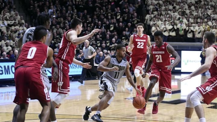 Jan 8, 2017; West Lafayette, IN, USA; Purdue Boilermakers guard P.J. Thompson (11) dribbles through the entire Wisconsin Badger defense of guard D'Mitrik Trice (0), forward Ethan Happ (22), guard Khalil Iverson (21) and others the 2nd half at Mackey Arena. Purdue defeated the Wisconsin Badgers 66-55. Mandatory Credit: Sandra Dukes-USA TODAY Sports
