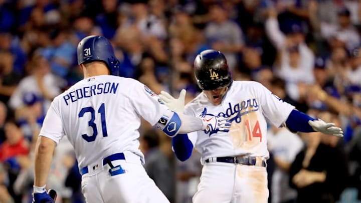 LOS ANGELES, CA - OCTOBER 04: Enrique Hernandez #14 of the Los Angeles Dodgers is congratulated by his teammate Joc Pederson #31 after his sixth inning home run against the Atlanta Braves during Game One of the National League Division Series at Dodger Stadium on October 4, 2018 in Los Angeles, California. (Photo by Sean M. Haffey/Getty Images)