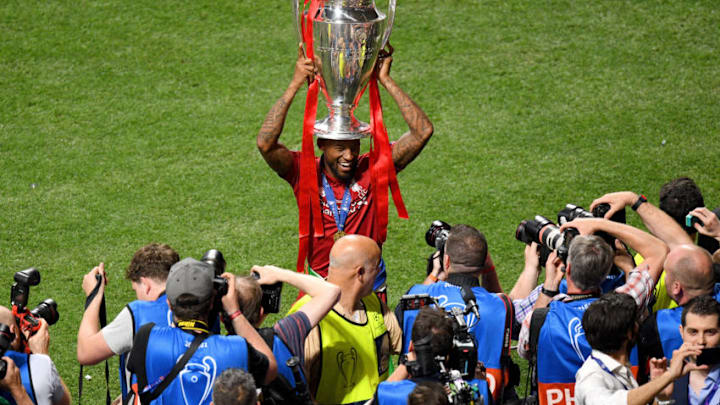 MADRID, SPAIN - JUNE 01: Georginio Wijnaldum of Liverpool lifts the Champions League Trophy after winning the UEFA Champions League Final between Tottenham Hotspur and Liverpool at Estadio Wanda Metropolitano on June 01, 2019 in Madrid, Spain. (Photo by David Ramos/Getty Images)