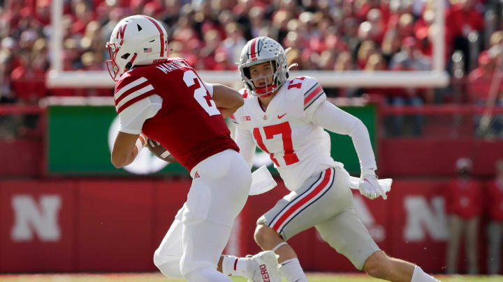 Nebraska Cornhuskers quarterback Adrian Martinez (2) is pursued by Ohio State Buckeyes safety Bryson Shaw (17) during Saturday’s NCAA Division I football game at Memorial Stadium in Lincoln, Neb., on November 6, 2021.Osu21neb Bjp 541