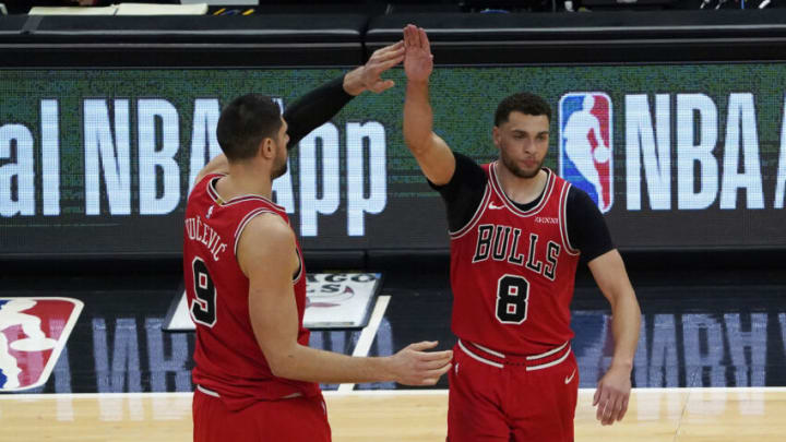May 7, 2021; Chicago, Illinois, USA; Chicago Bulls guard Zach LaVine (8) celebrates his three point basket against the Boston Celtics with center Nikola Vucevic (9) during the second half at United Center. Mandatory Credit: David Banks-USA TODAY Sports