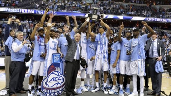 Mar 12, 2016; Washington, DC, USA; North Carolina Tar Heels hoist the trophy on the stage after defeating Virginia Cavaliers 61-57 the championship game of the ACC conference tournament at Verizon Center. Mandatory Credit: Tommy Gilligan-USA TODAY Sports